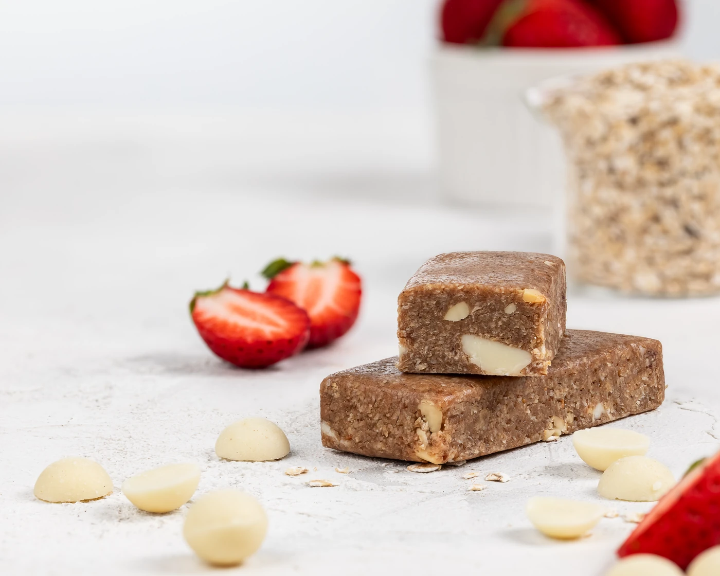 MojoBite strawberry white chocolate oat bar with fresh strawberries