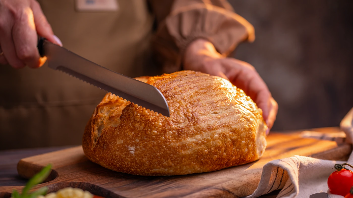 Slicing artisan bread - revealing the soft interior crumb