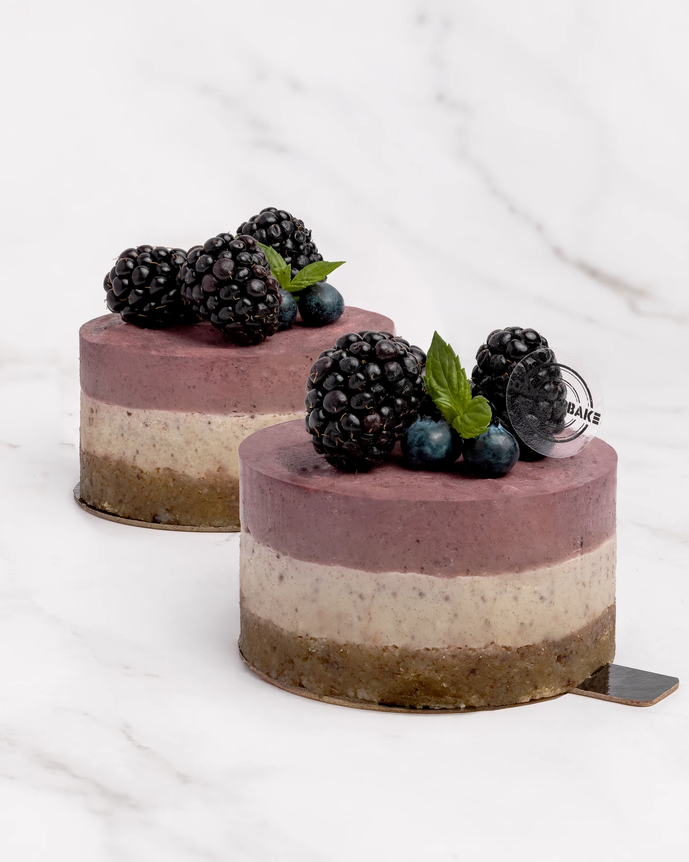 Berry cake with blackberries and blueberries - purple layered composition