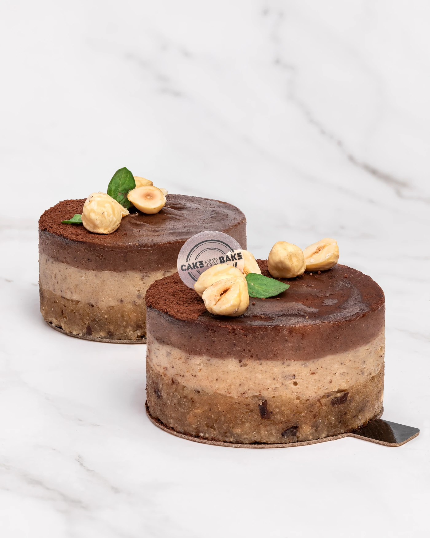 Chocolate hazelnut cake - dark chocolate layers with whole hazelnut garnish