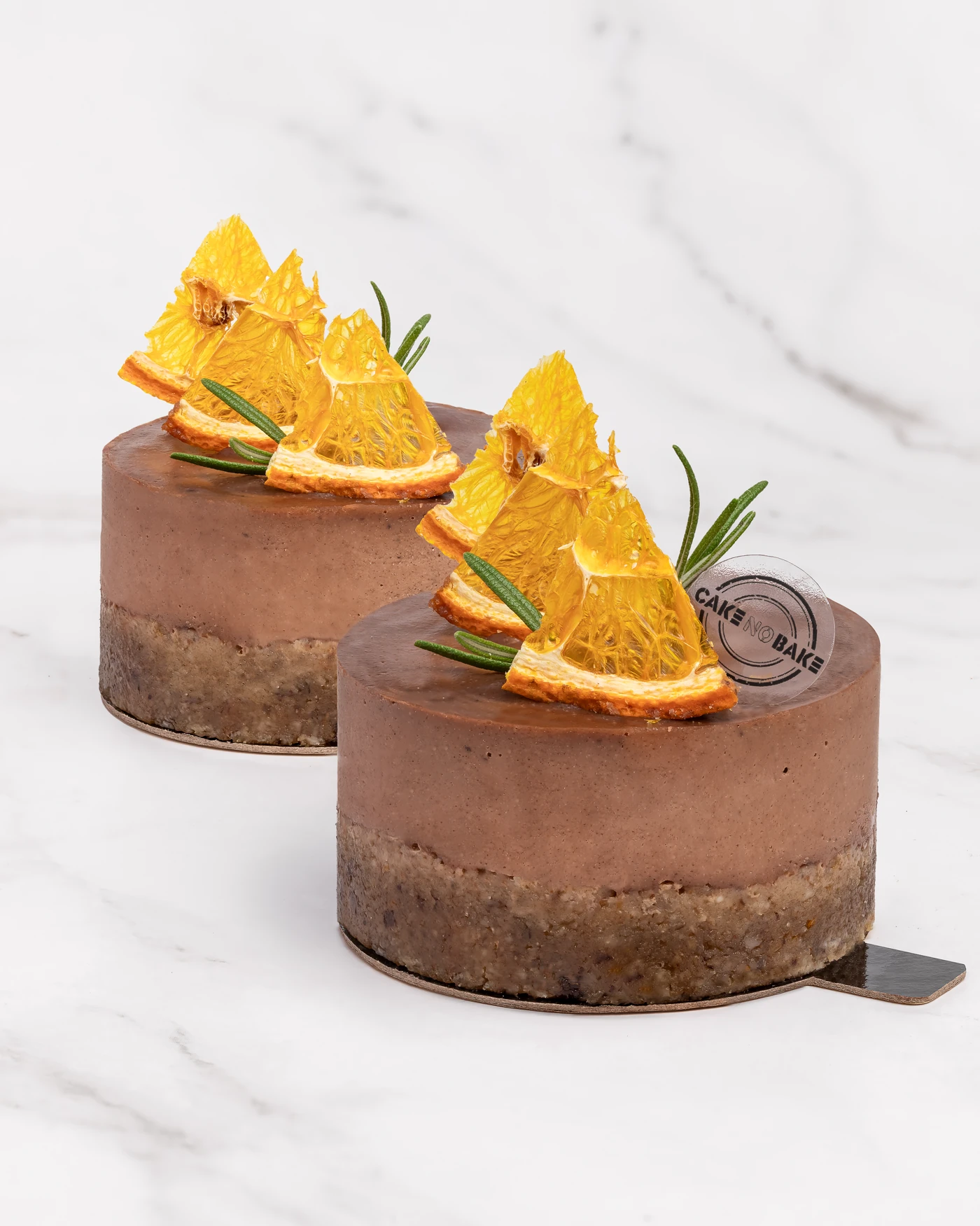 Chocolate orange cake with rosemary - individual portion on marble