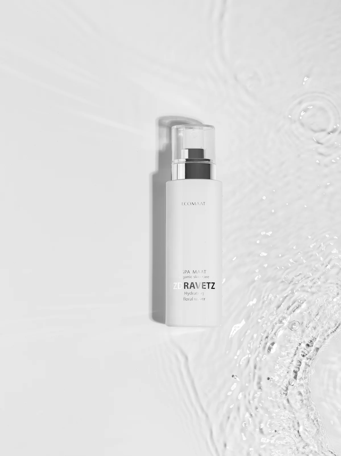 ECOMAAT floral water bottle surrounded by water ripples