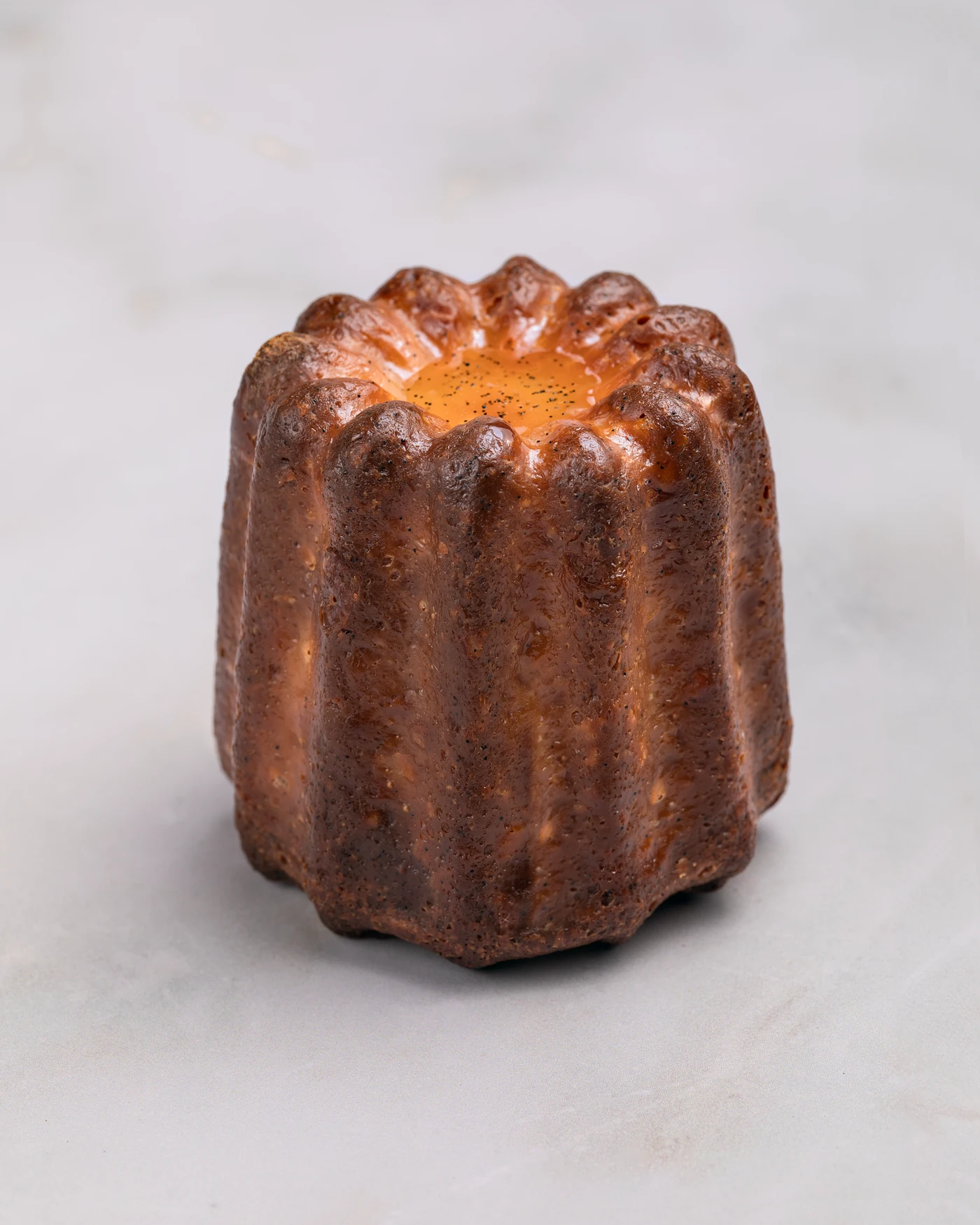 Canele - caramelized exterior and custard interior