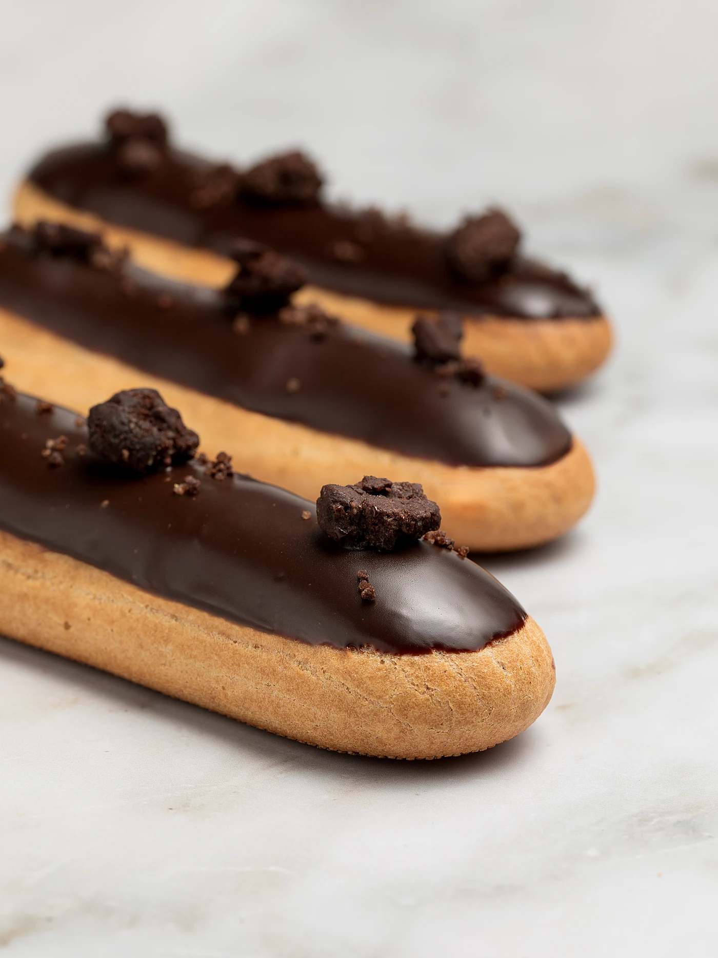 Chocolate eclairs with dark ganache glaze