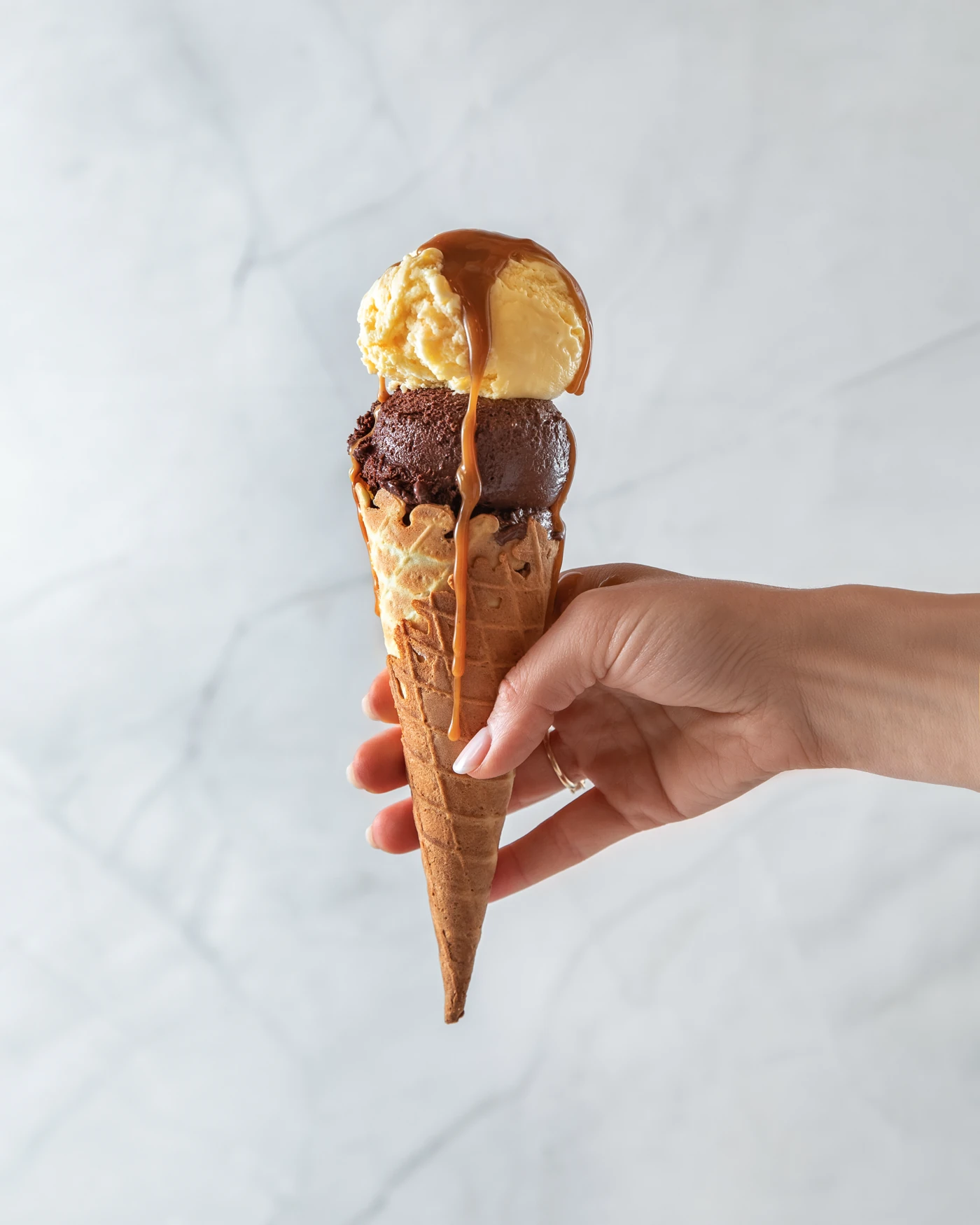 SaviGelato ice cream cone - hand-held lifestyle shot