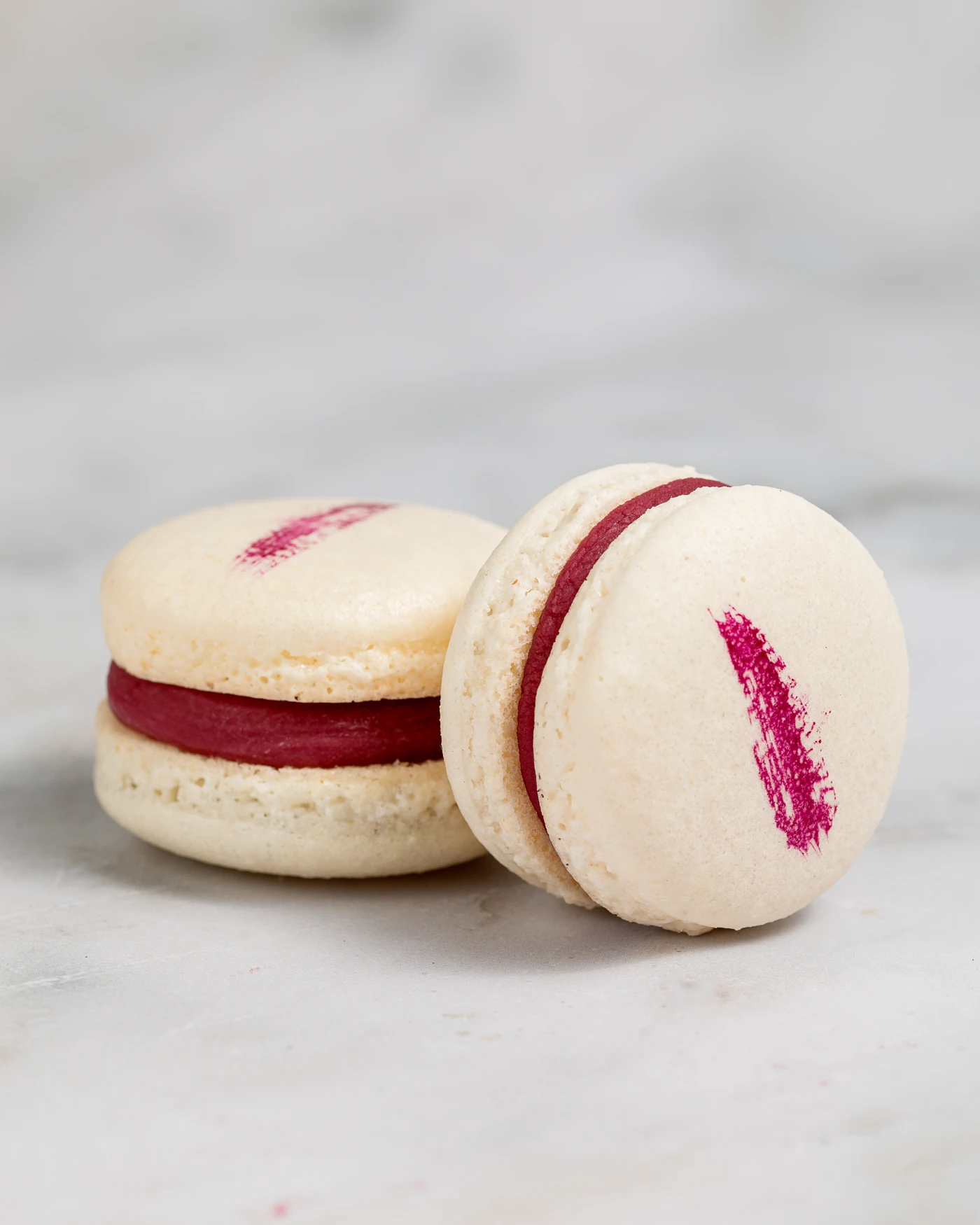 French macaron - precise cross-section showing raspberry ganache