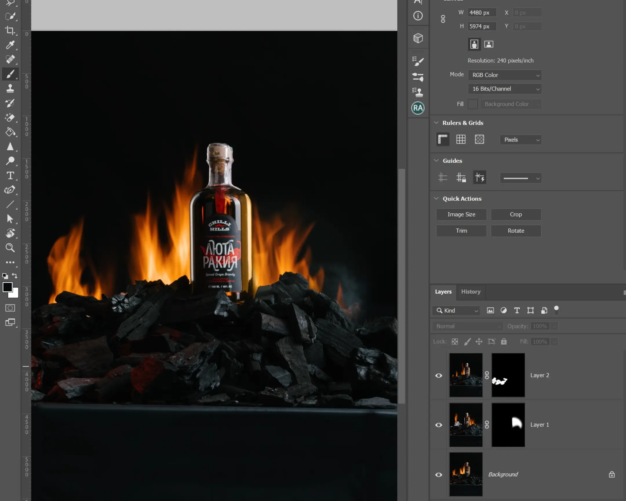 Dynaphos Product Photography Master Class: Chilli Hills Lyuta Rakiya bottle on flaming coals, showing real fire effects in Photoshop.