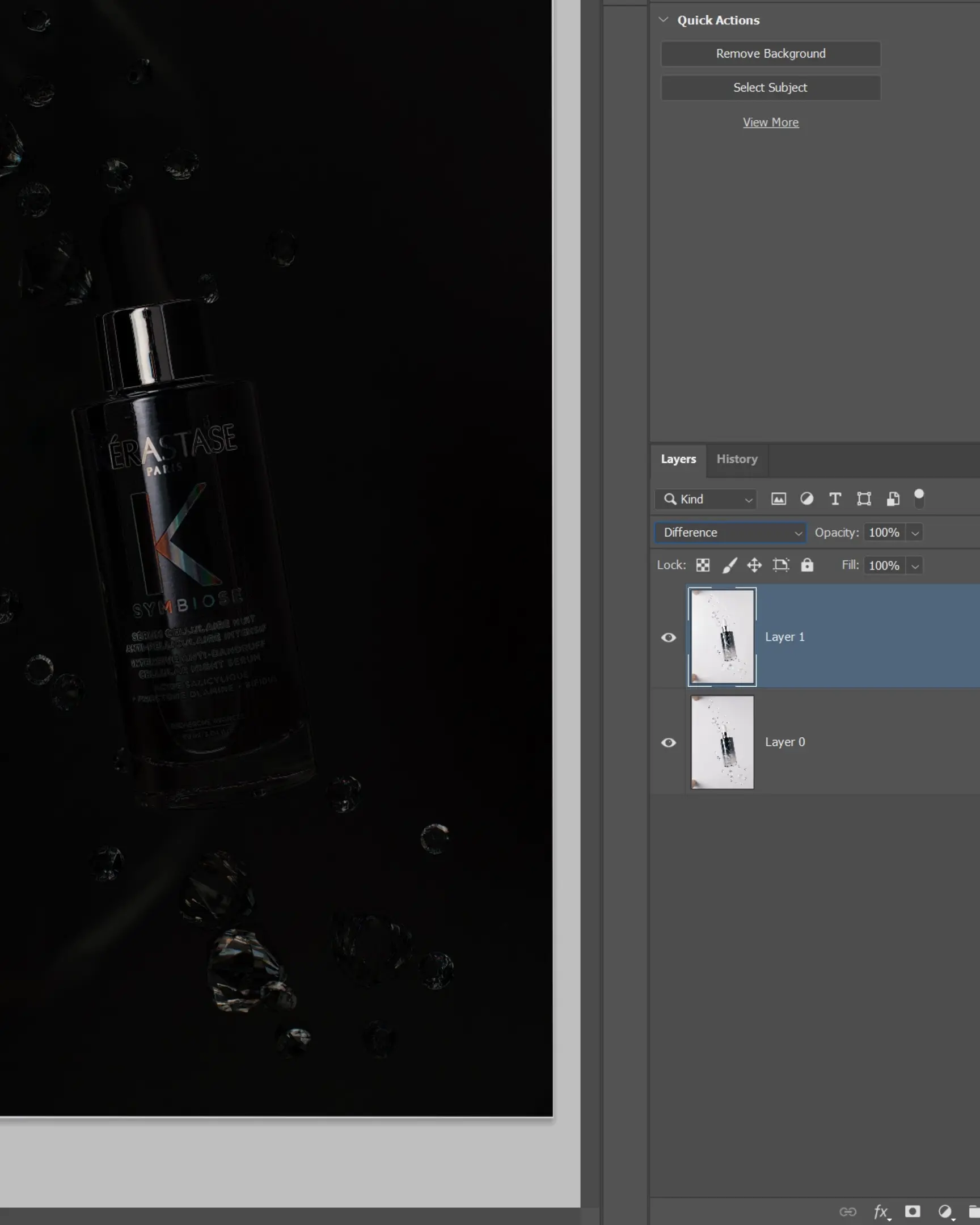 Kérastase Symbiose serum bottle with suspended droplets on black for product photography using glass.