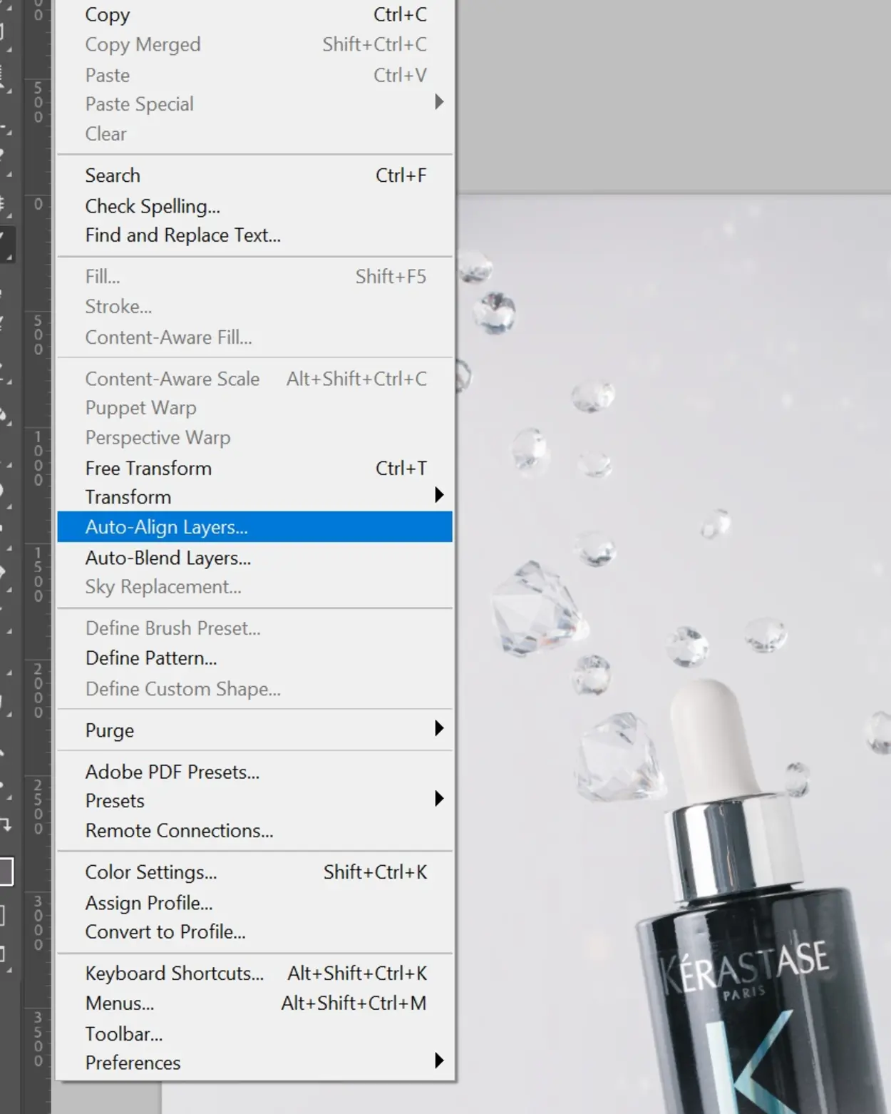 Kérastase oil bottle with suspended droplets for "wow effect" product photography using glass technique.