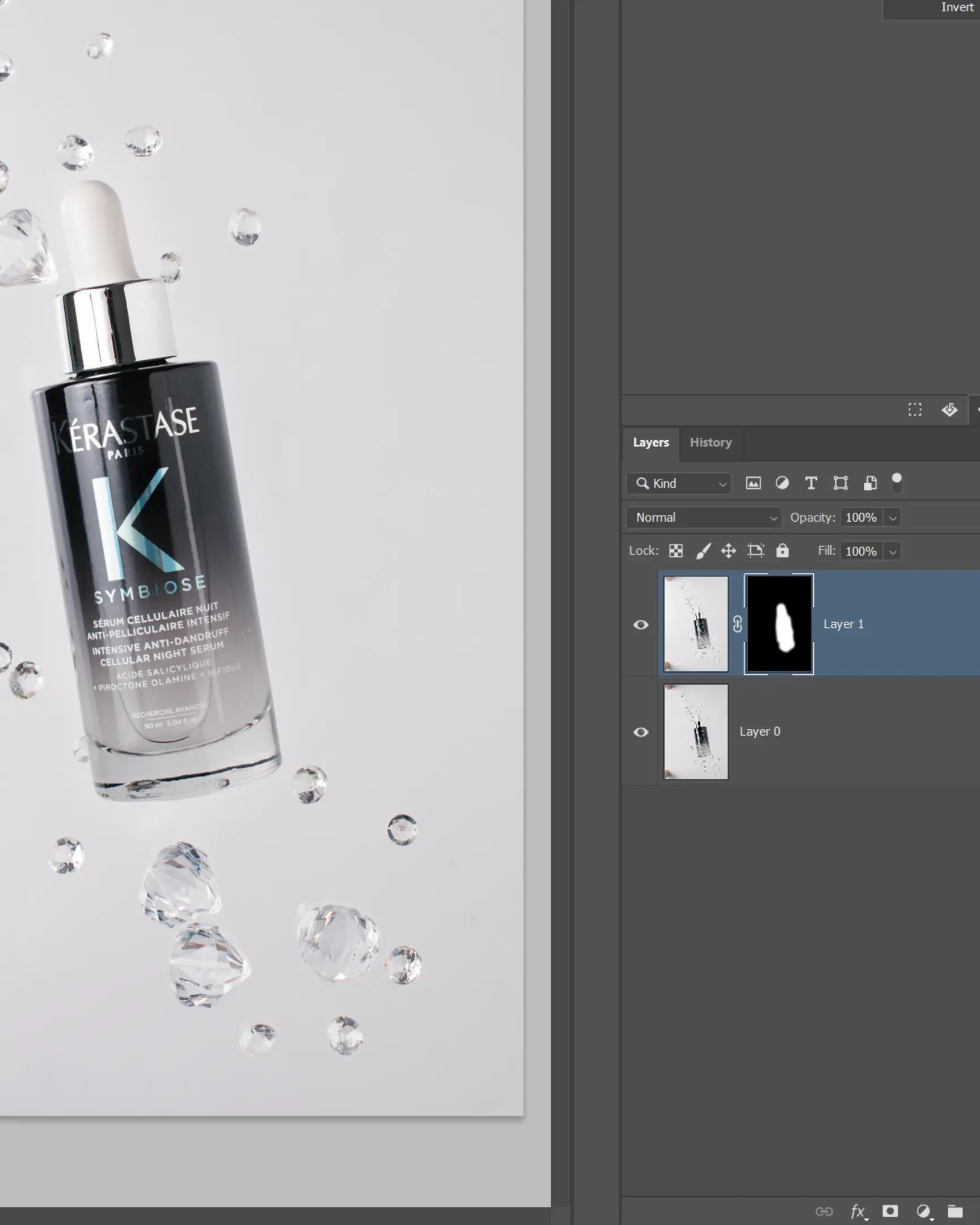 Kérastase Symbiose serum with suspended clear gems on white for glass product photography & editing.