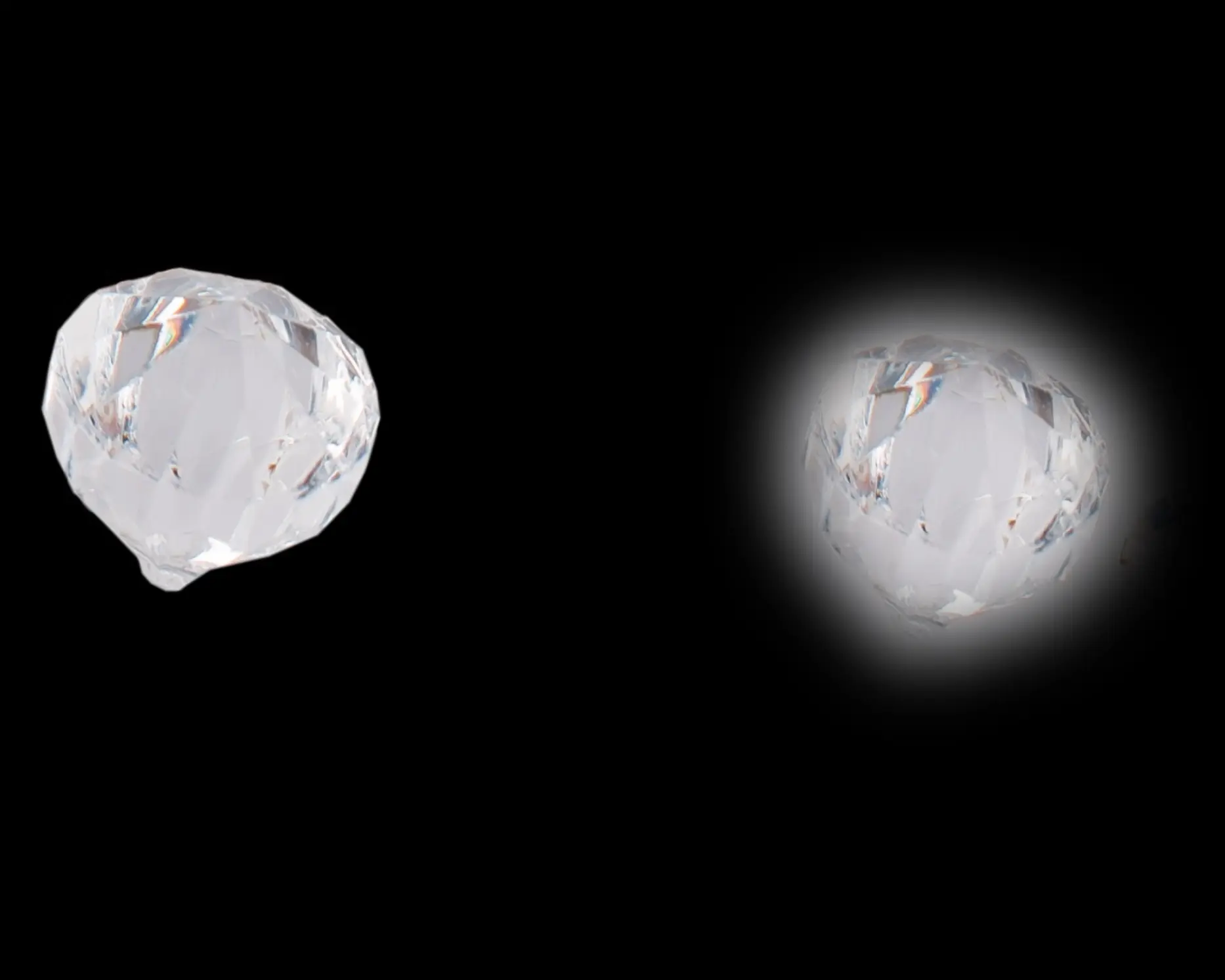 Two faceted glass crystals floating on black, demonstrating suspended effects for product photography using glass.