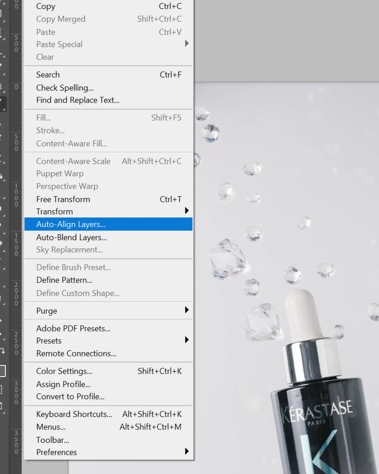 Kerastase product bottle with suspended droplets, showcasing wow effect for product photography with glass.