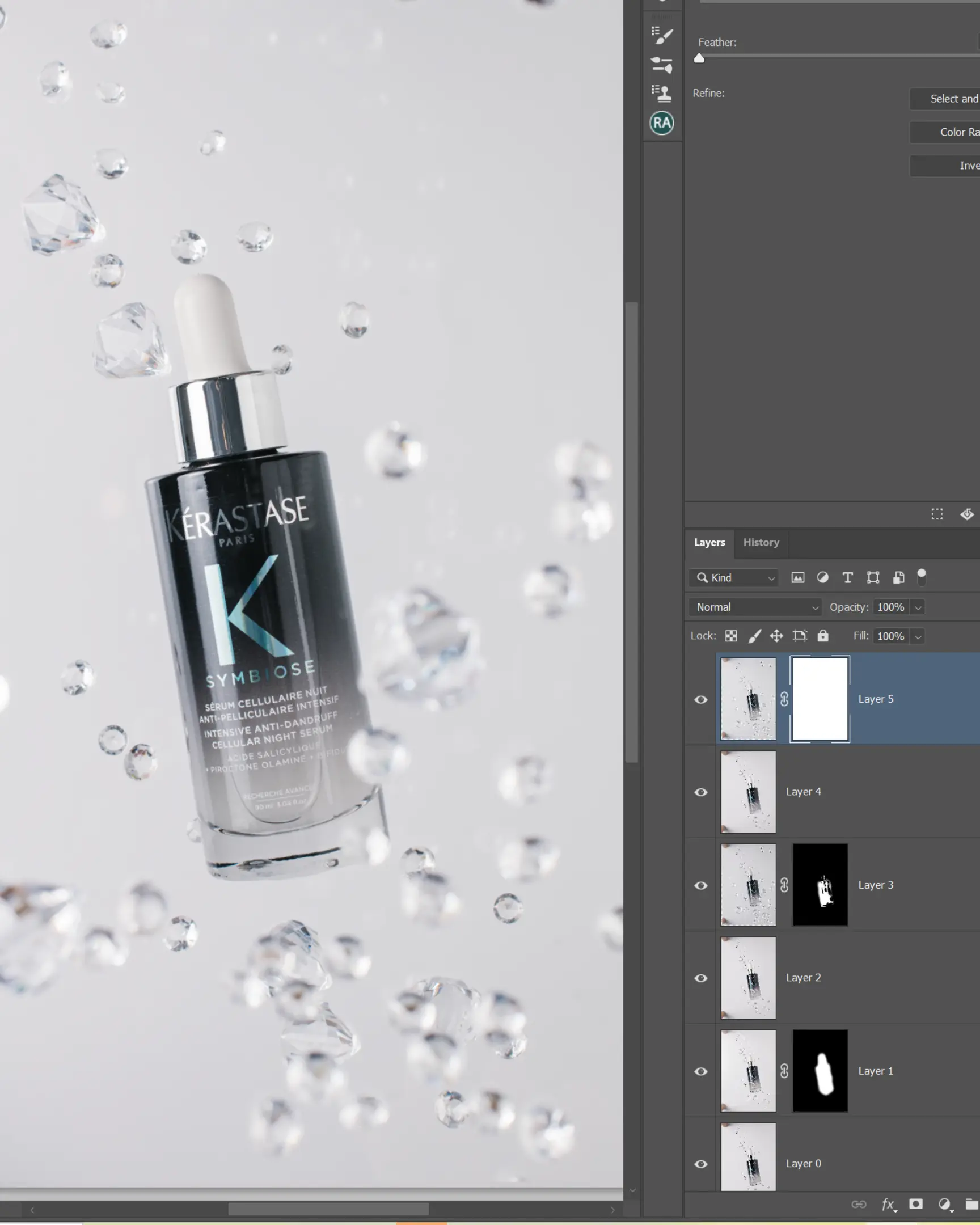 Kérastase Symbiose Cellular Night Serum bottle floating with suspended droplets, demonstrating glass product photography.