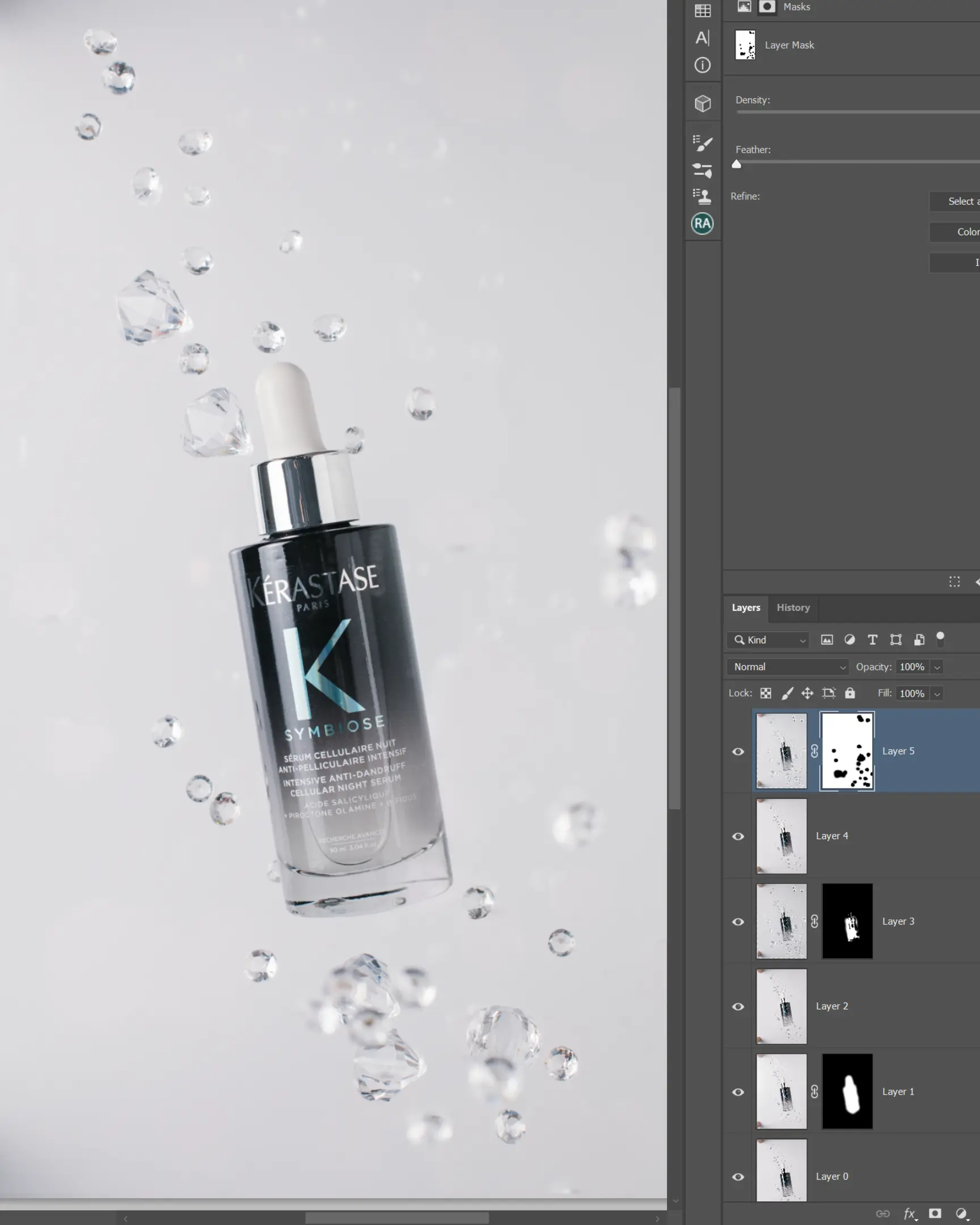 Kérastase Symbiose Cellular Night Anti-Dandruff Serum bottle with floating clear droplets on white, product photography with glass.