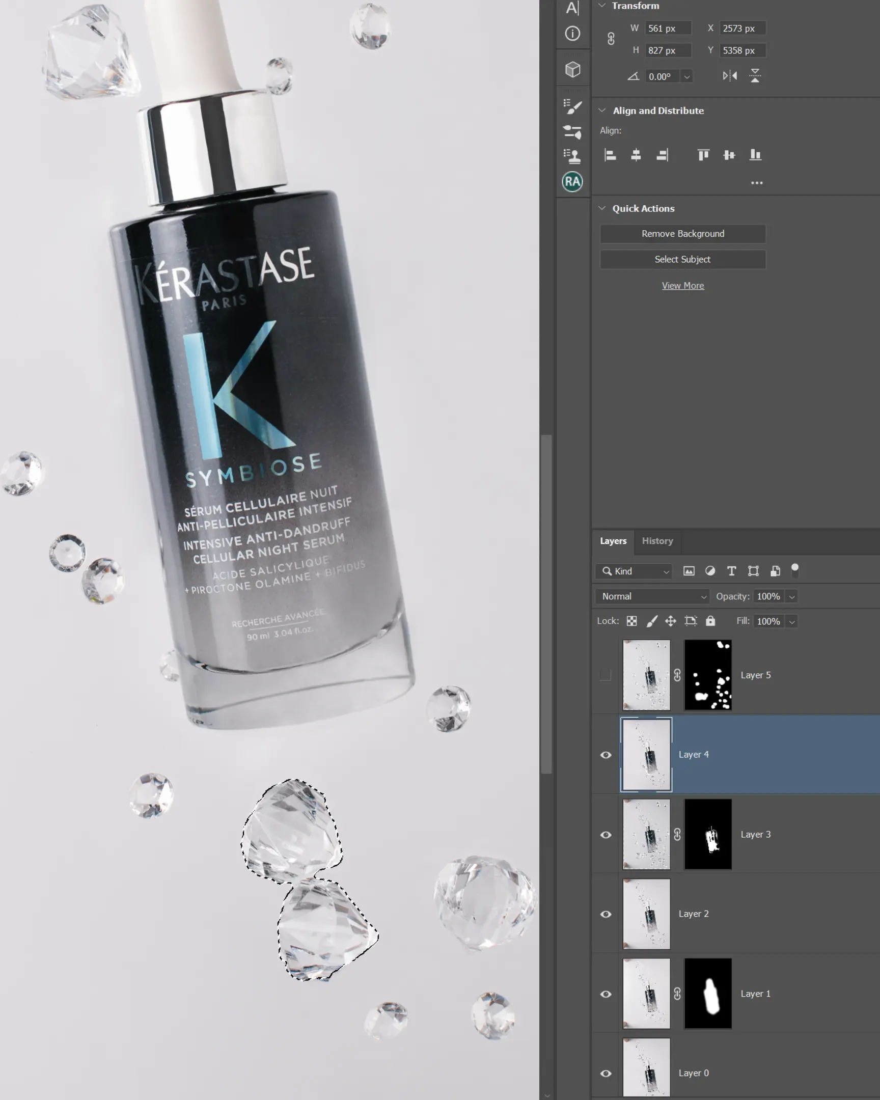 Kérastase Symbiose Cellular Night Serum bottle with floating crystal droplets for product photography using glass technique.