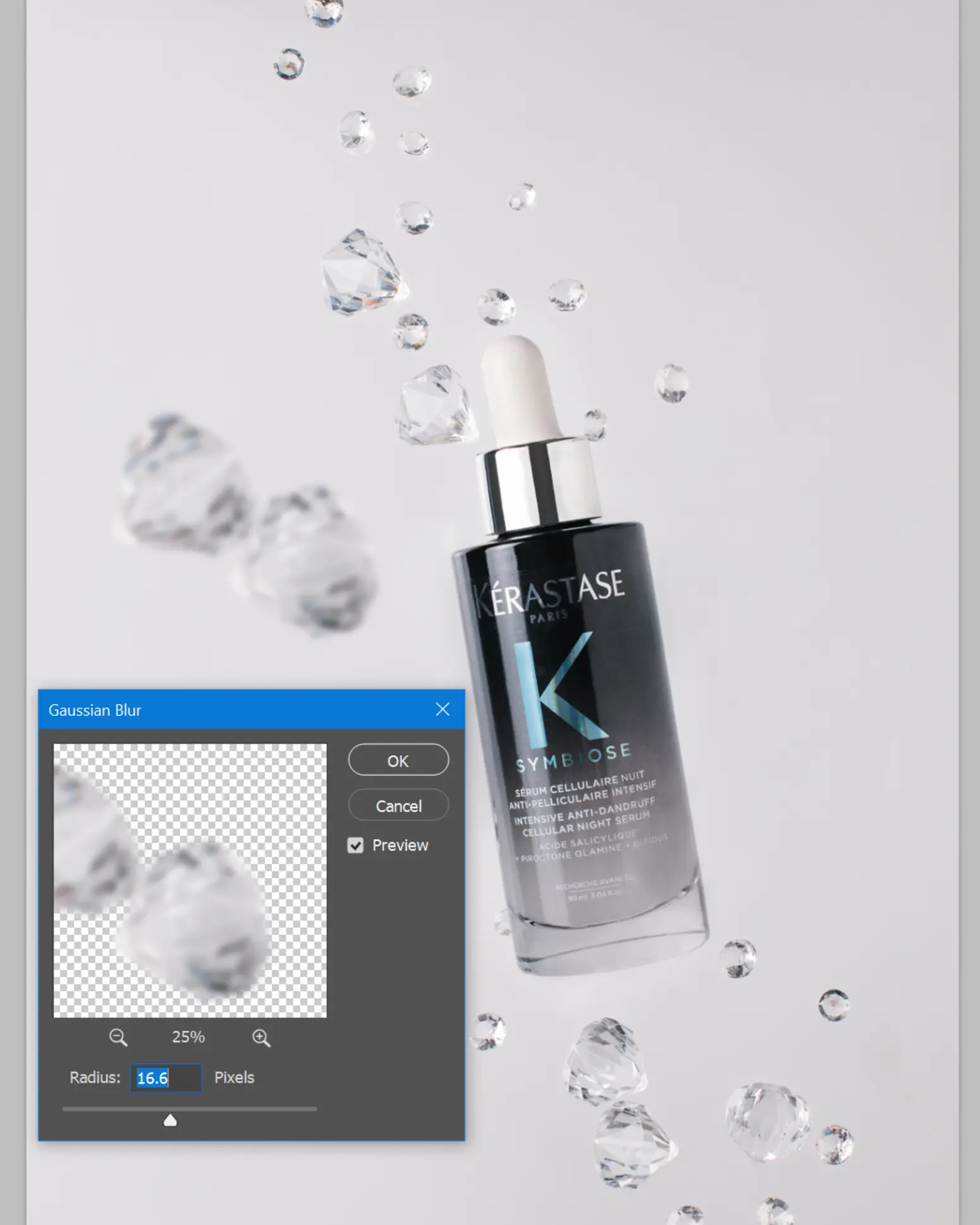 Kérastase Symbiose serum bottle with suspended droplets, Gaussian Blur setting. Glass product photography technique.