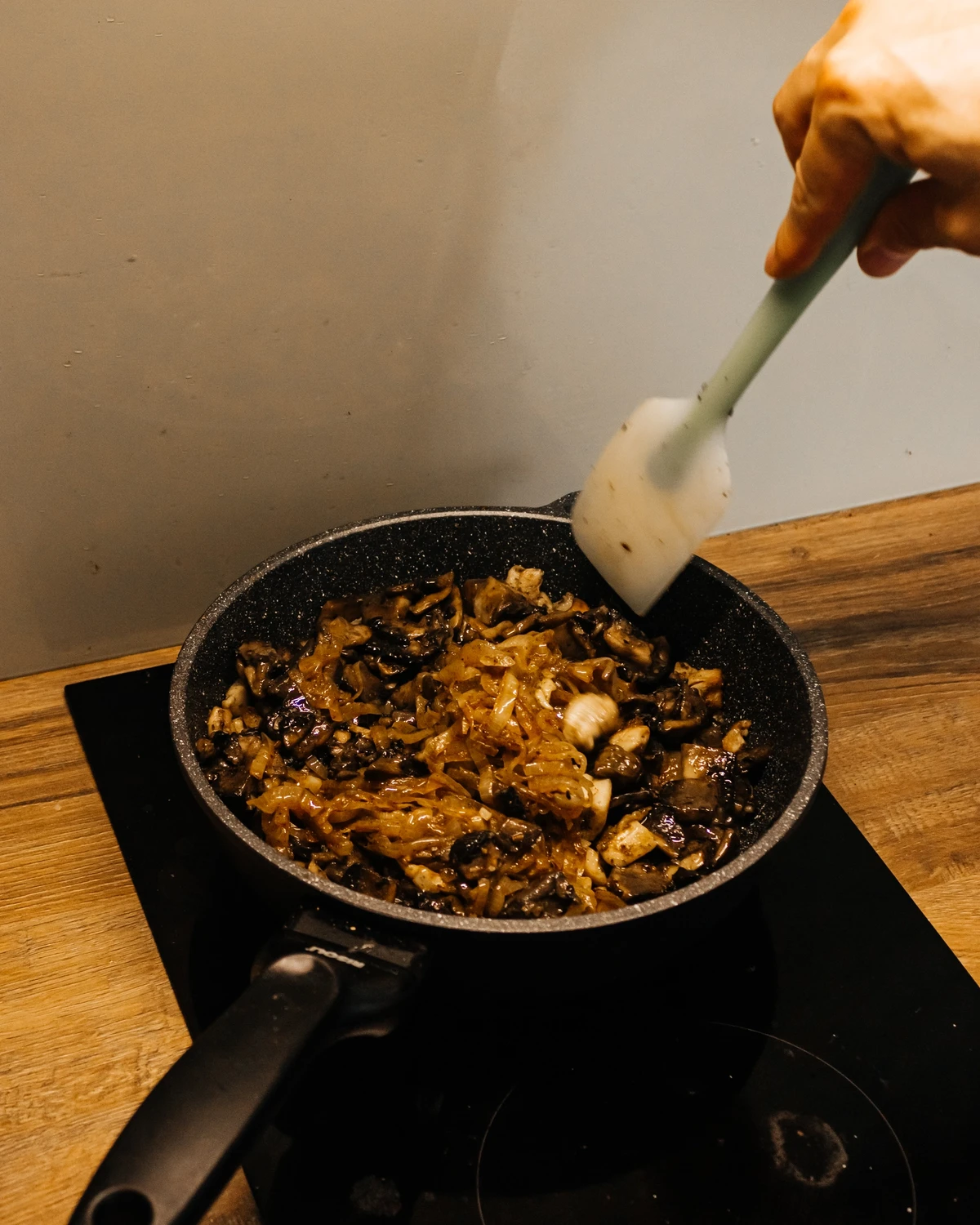 Frying mushrooms and onions for the traditional Belarusian potato babka (kugel) filling.