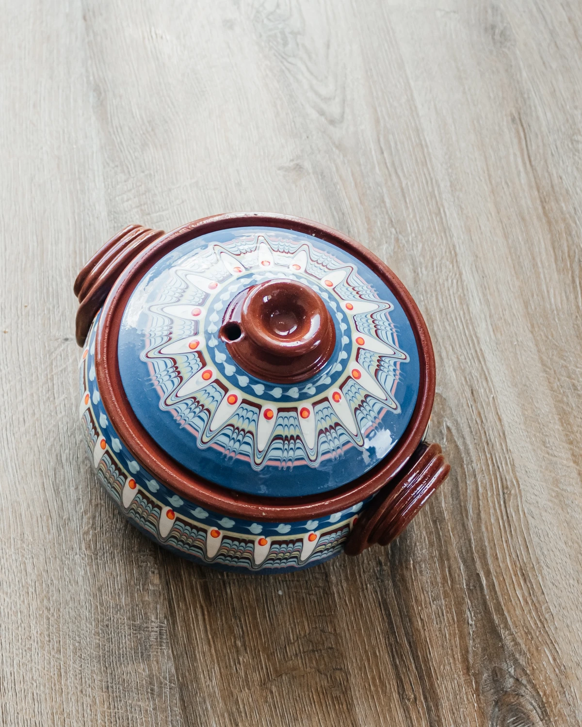 Colorful, traditional clay pot for baking Belarusian potato babka or Jewish kugel casserole.