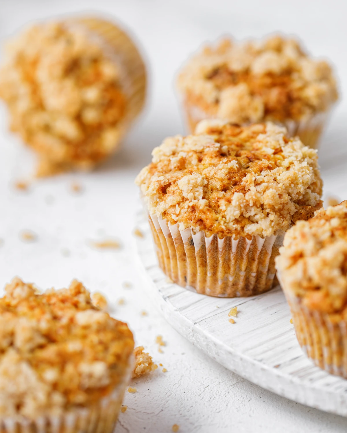 Delicious, freshly baked carrot muffins with crunchy golden crumble topping.