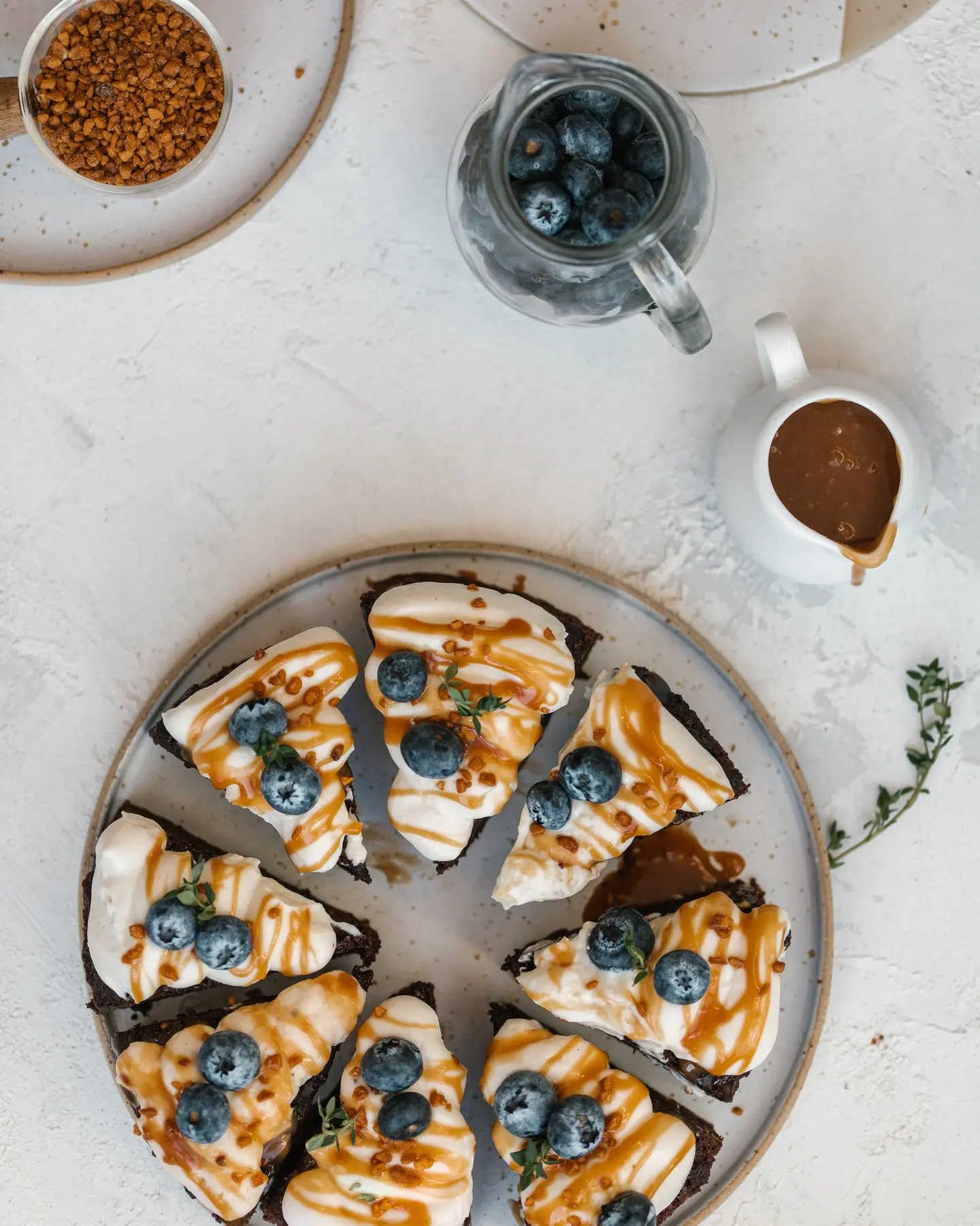 Banana Chocolate Cupcake portions with mascarpone, blueberries, caramel, and nuts.