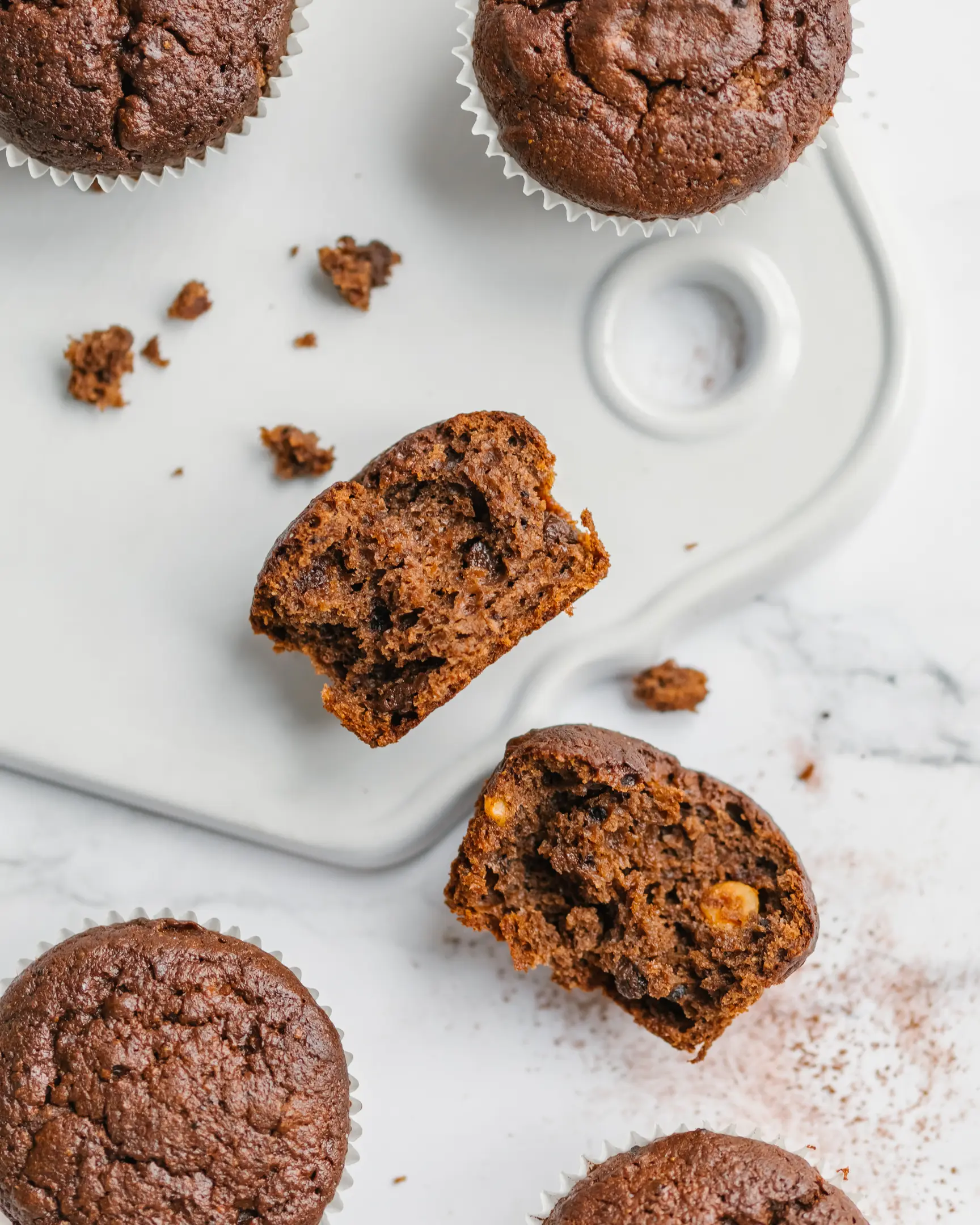 Sliced orange bundt cake with glossy orange glaze and fresh zest.