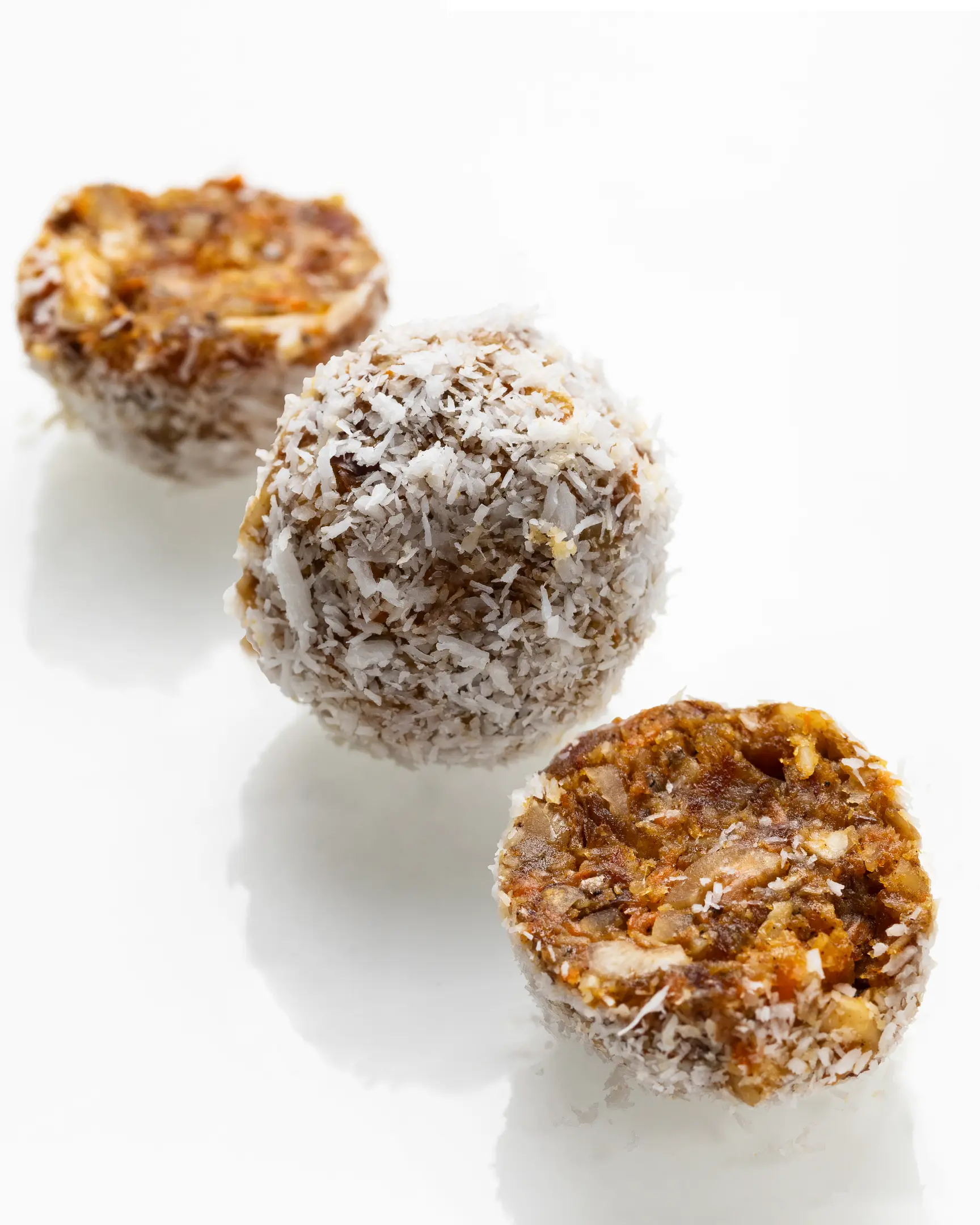 Natural almond-apricot candies with shredded coconut. Healthy, no-sugar energy balls for breakfast.